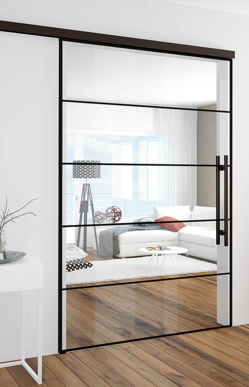 Loft-Glasschiebetür im Industrial-Design als Wohnzimmerabtrennung neben Standspiegel